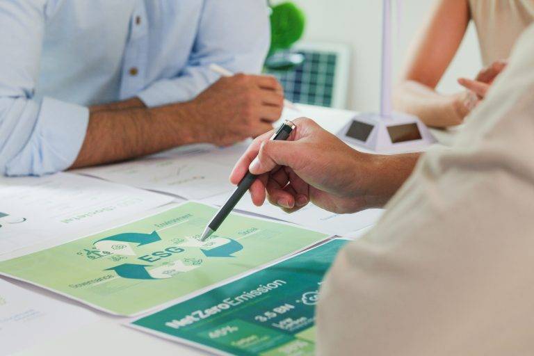 Closeup group Asia businesspeople talk ESG strategies risk manag